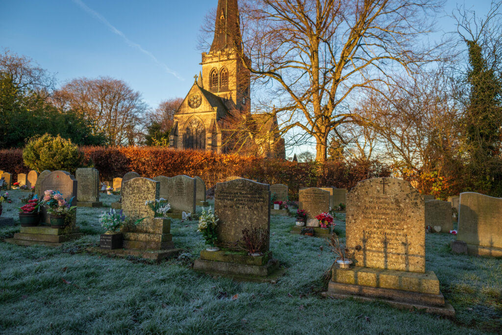 picture showing a churchyard with graces on a frosty morning
